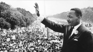 Martin Luther King addressing a large crowd tolerance