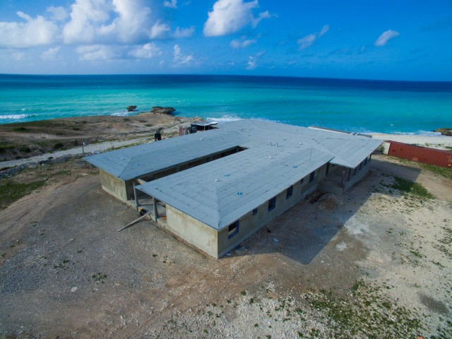 Aerial photo of guest house and their ocean front view