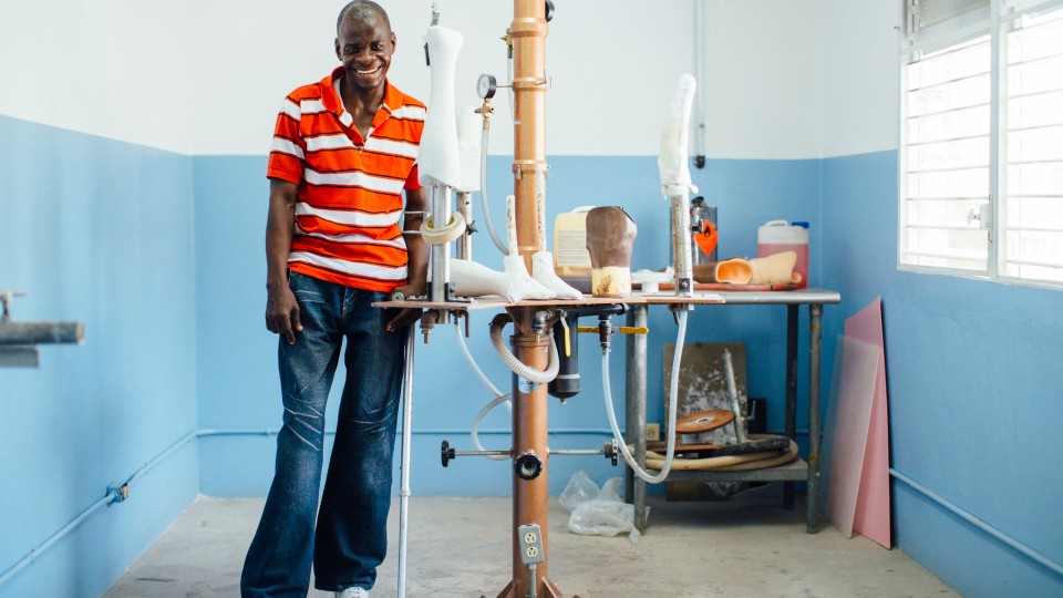 A lab technician makes prosthetic limbs