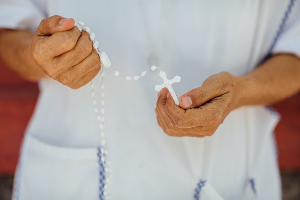 nun with rosary