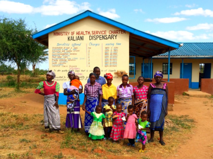women outside a health dispensary in Kenya