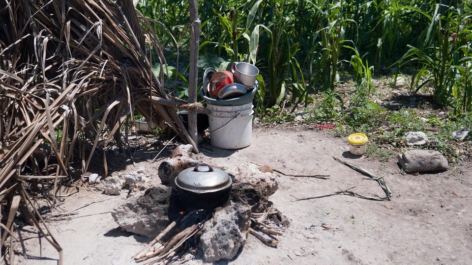 Cooking pot and open fire pit for cooking. Haiti families need help.