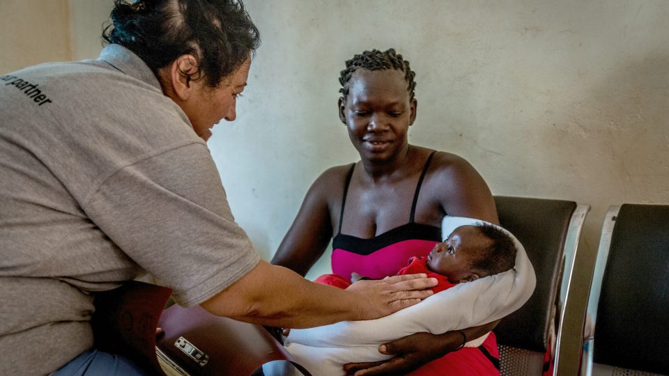 Dr. Rachael Consoli with a mother and her baby. Safe motherhood in South Sudan.