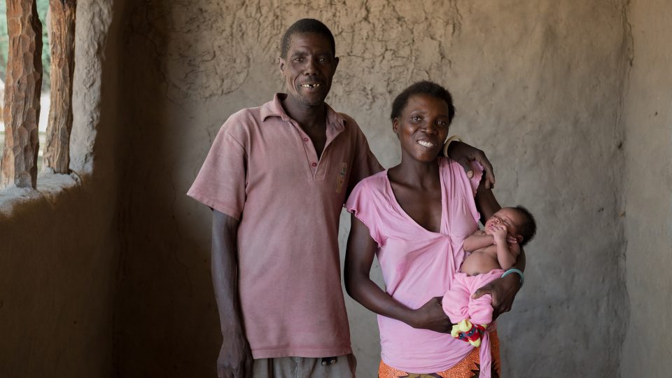Men Taking Action Men taking action in Zambia. A photo of a father, mother and child.