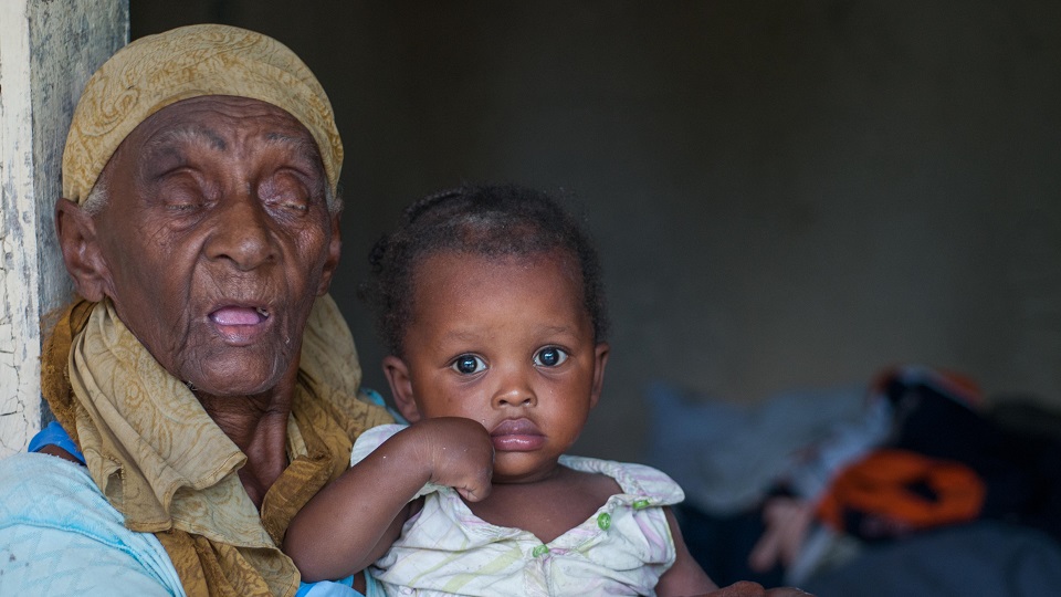 Darline with her grandmother. Sponsor a child in Haiti.