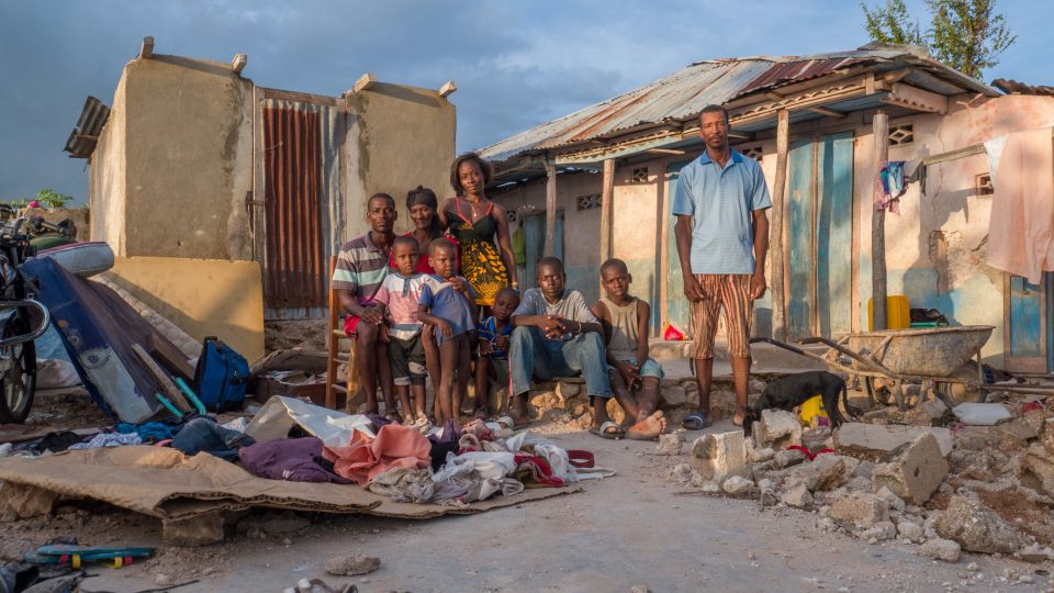 Hurricane Matthew Victims A family sit in front of their home that was destroyed by hurricane matthew