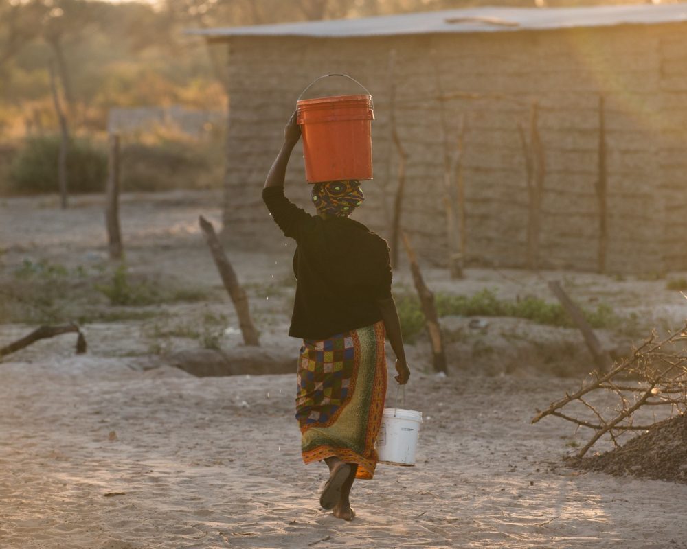 woman carrying water in Zambia