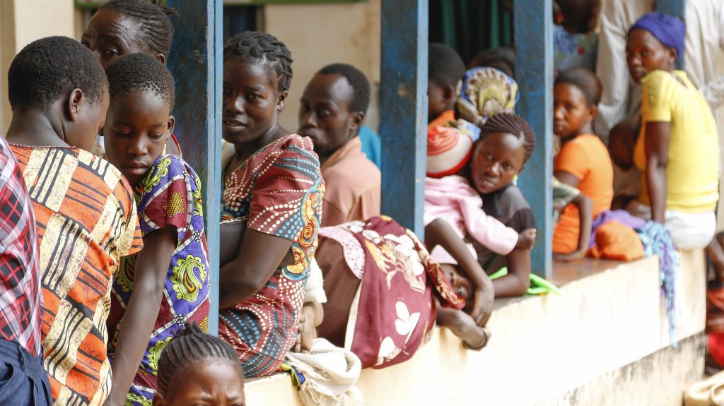 People wait for care at a clinic.