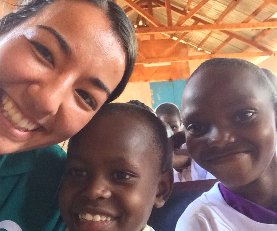 volunteer-anne-with-some-children Volunteer Anne with children during world aids event in Kenya