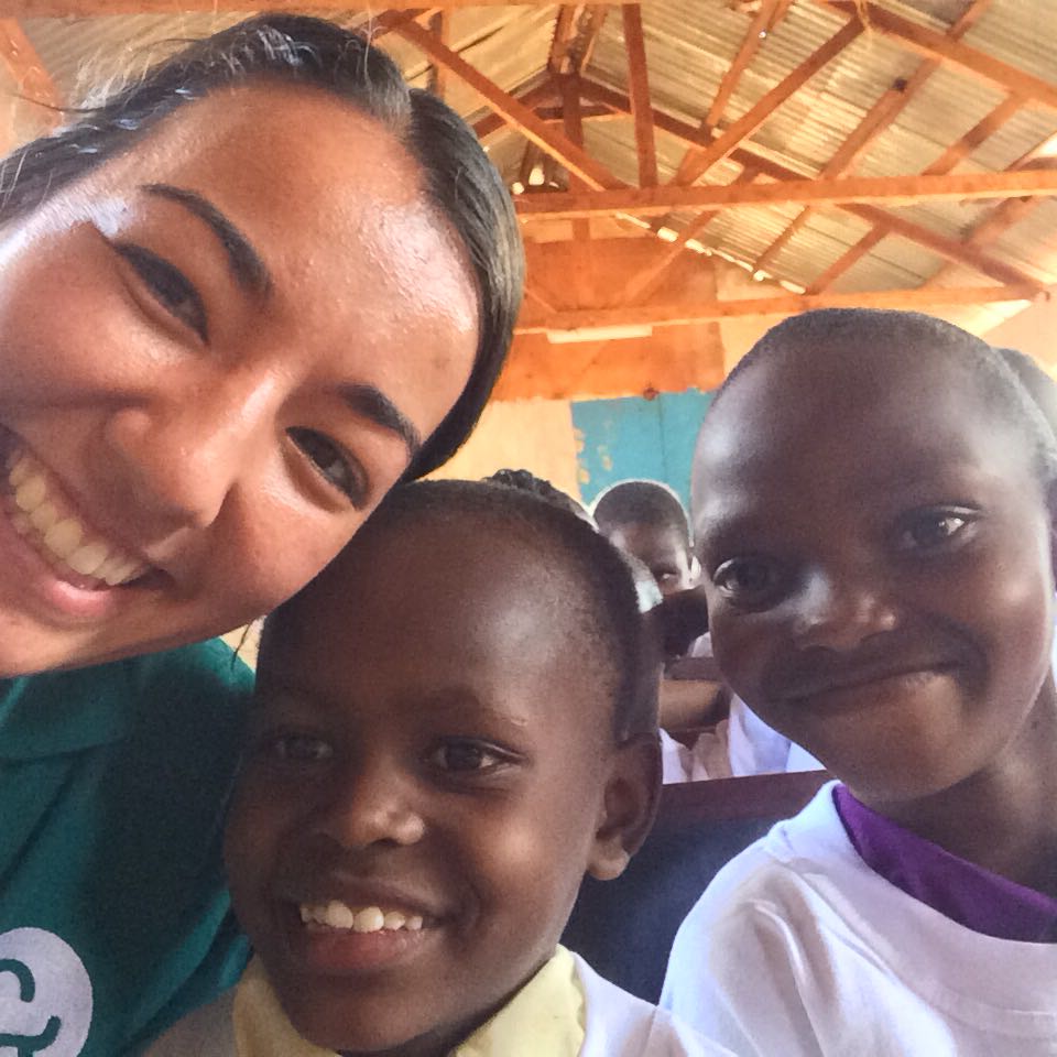 Volunteer Anne with children during world aids event in Kenya