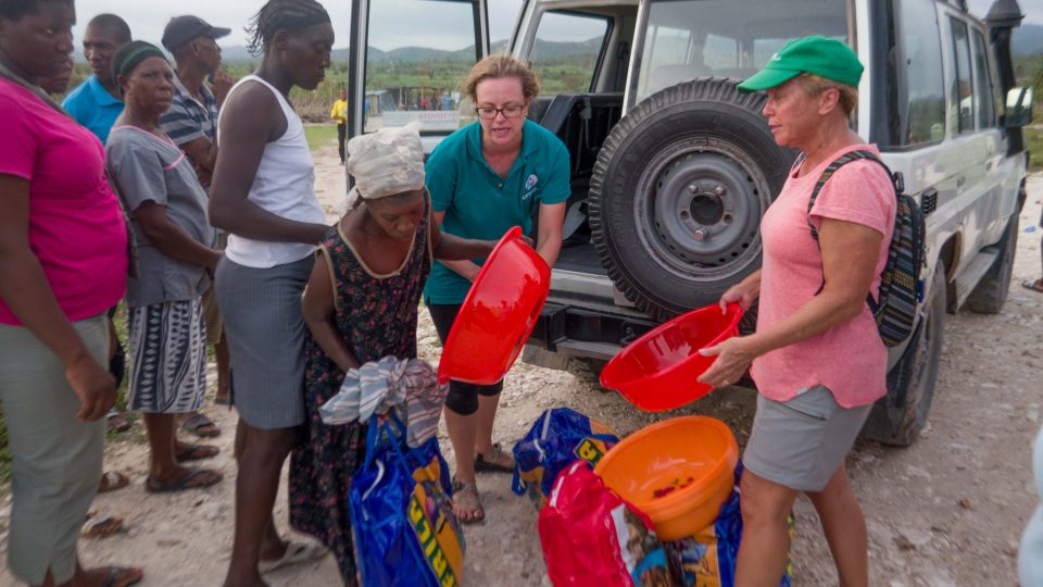 Brittany Jonap and fellow volunteer Robin Maddox give out emergency relief kits to impacted community members hurricane matthew