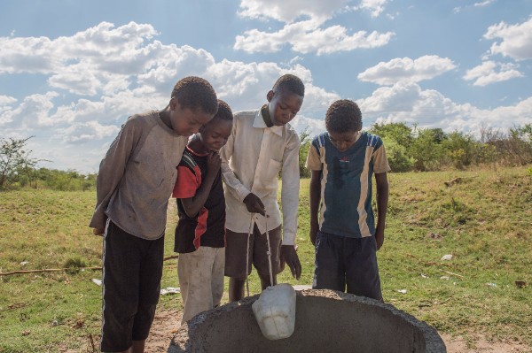 boys around a well - Zambia