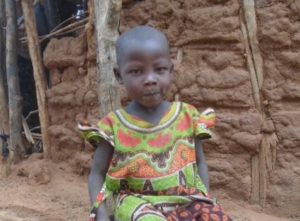 4-year-old Wanzia Ngandi outside her home
