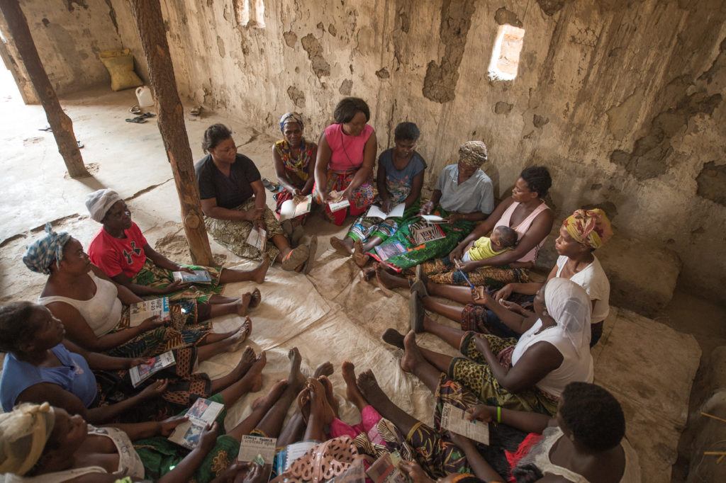 A symbol of catholic charity in action- picture of mothers sitting in a circle in Zambia