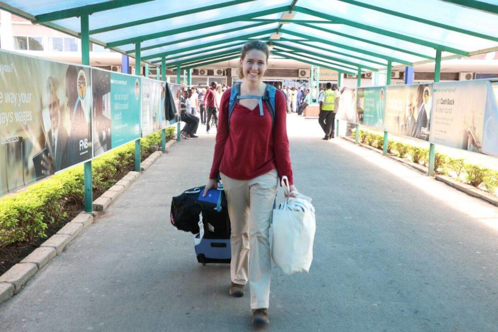 Rose arrives in Lusaka at international airport.