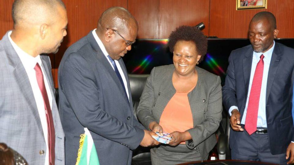 CMMB country director, Batuke Mwewa hands over water purifiers to Health Minister Chitalu Chiufya as local government minister Vince Mwale and Water Development, Sanitation, and Environmental protection counter part Lloyd Kaziya look on at the Ministry of Health.
