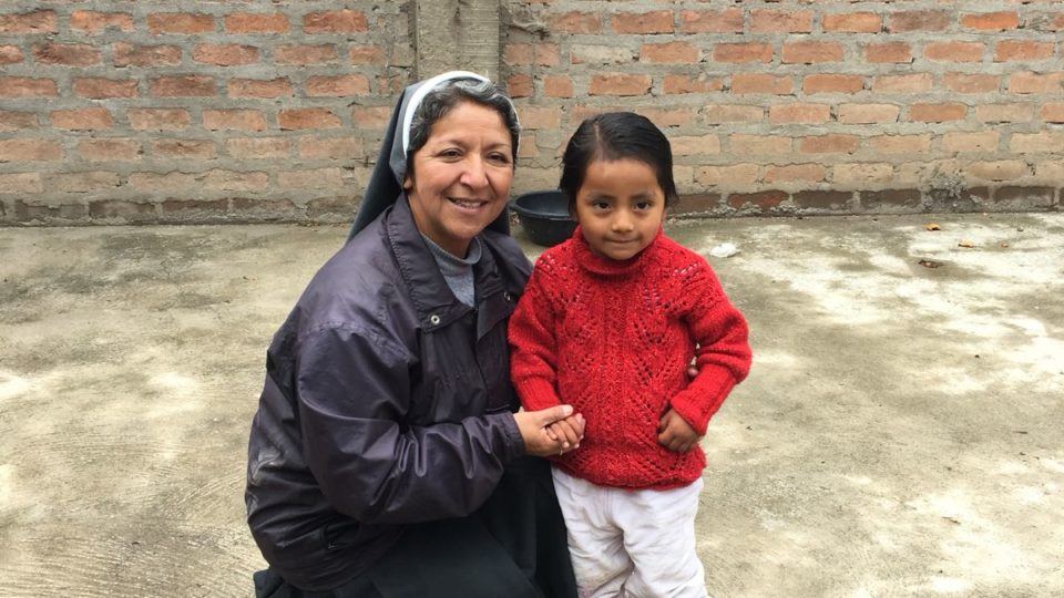 Sister Elena in Peru with a beneficiary.