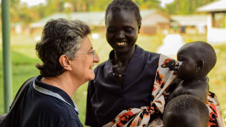 Sister Laura interacting with mom and child at St. Theresa Hospital in Nzara