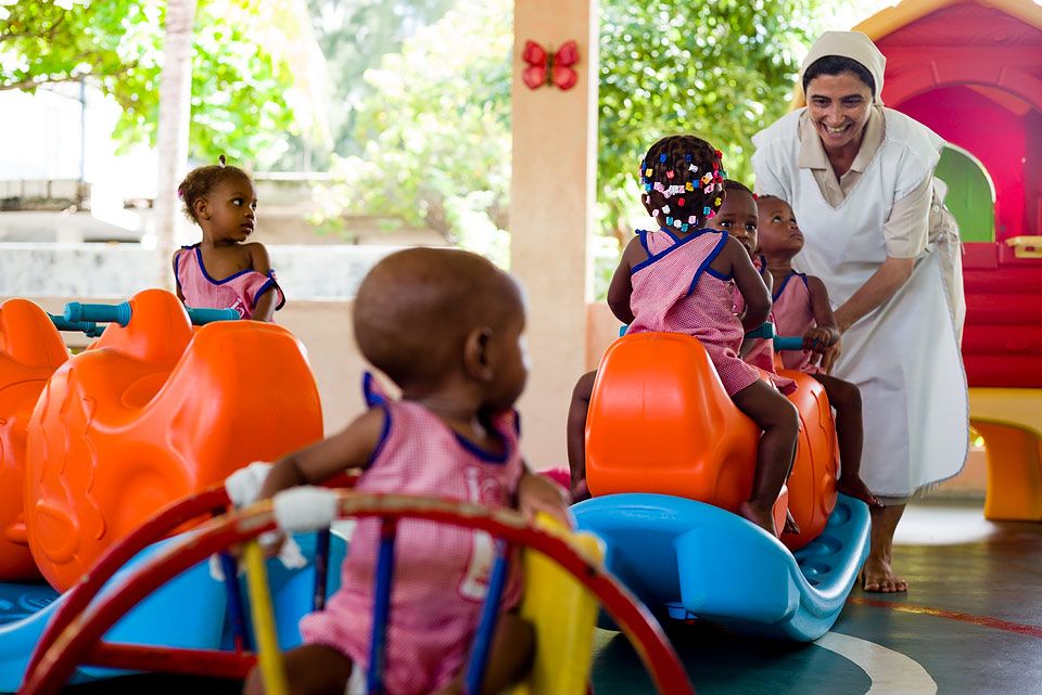 Sister Maria playing with children where she works