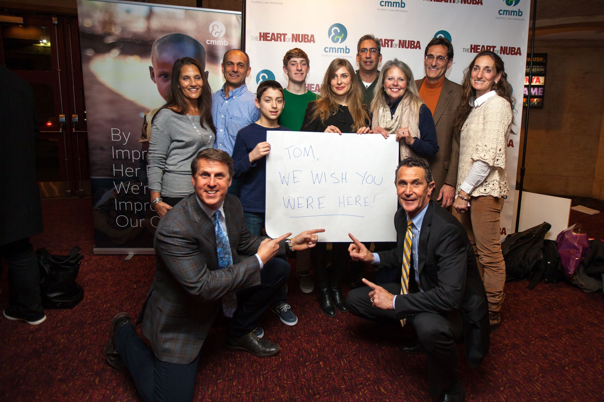 Ken Carlson (bottom left) with many members of Tom Catena's family, and CMMB CEO and president, Bruce Wilkinson (bottom right) at the exclusive premiere of The Heart of Nuba in NYC. 