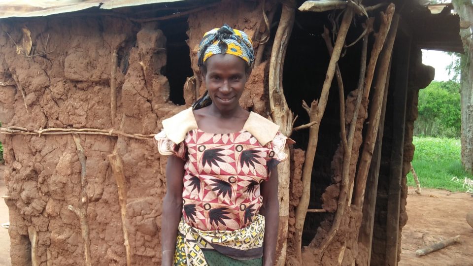 Caroline, Mawia's mother standing outside her home