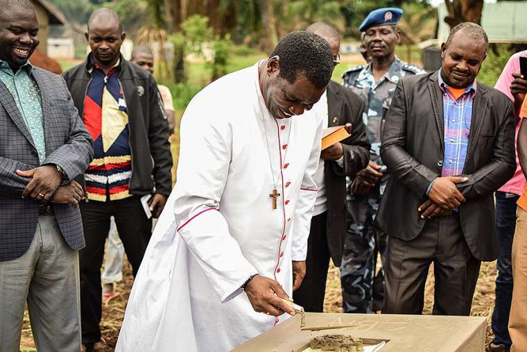 Bishop Edward Kussala of Tombura-Yambio lays the ceremonial cornerstone at the new facilities of St. Theresa Hospital in Nzara, South Sudan, April 7, 2018