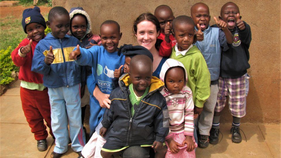 Sarah with children in Kenya