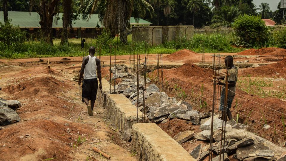 Workmen at St. Theresa Hospital at Nzara. New surgical unit and blood bank.