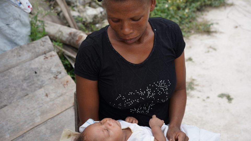 Chrisnete with Michael Michael being held by his mom.