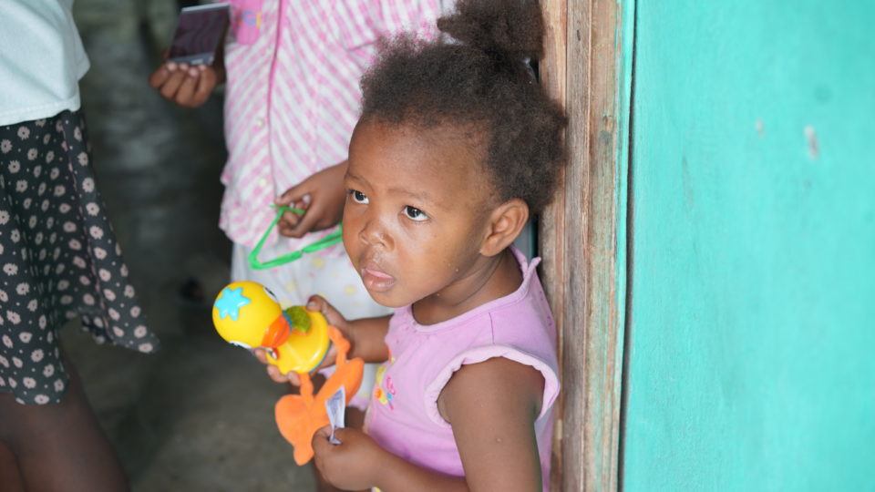 Francesca at her home in Haiti with her older sister, Laurie.