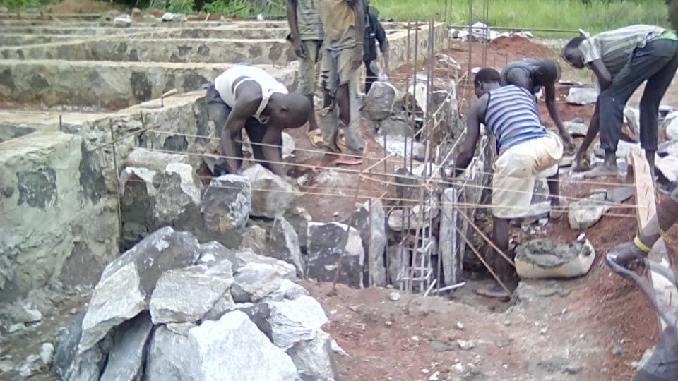 Masons lay the Veranda Foundation at Theatre