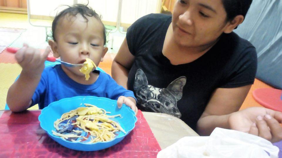Anghelo and his mom during mealtime