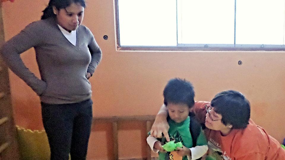 Jordan, participating in a therapy session with his mom - CMMB Peru Angel
