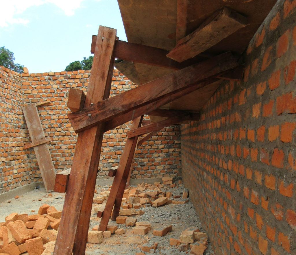 Mahogany scaffolding used at St. Theresa Hospital to support the brick walls.