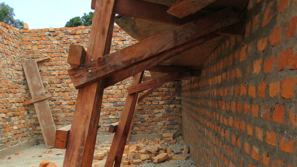 Mahogany scaffolding used at St. Theresa Hospital to support the brick walls.