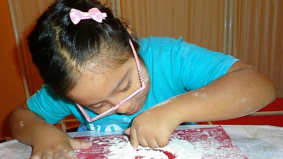 Maryori completing a therapy activity - CMMB Peru Angel