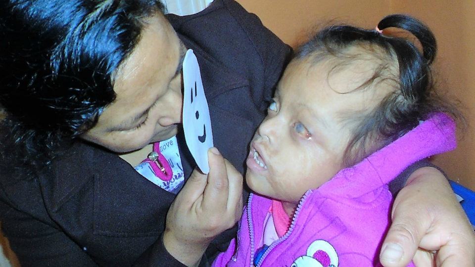 Milusaca with a family member - CMMB Angel Peru