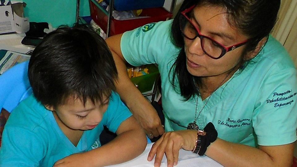 Rodrigo with one of his therapists - CMMB Peru Angel Rodrigo with one of his therapists - CMMB Peru Angel