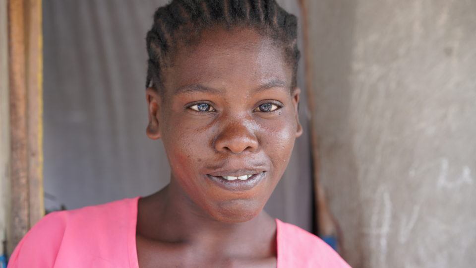 Etiene's mom, Louina. She has an eye condition that she has not been able to get fixed.