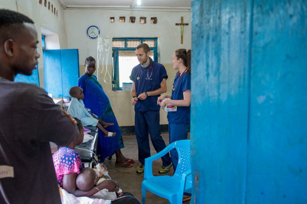 Dr. Matthew Jones stands talking with Oliver and his mom in the procedure room at St. Theresa Hospital in South Sudan