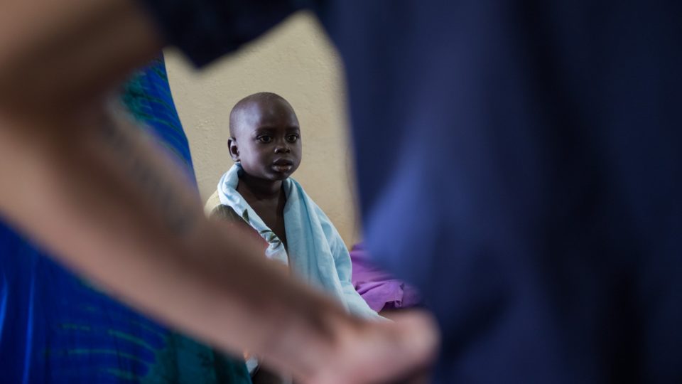 Young oliver waits to be seen by aurora fellow and volunteer, Dr. Matthew Jones, at St. Theresa Hospital.