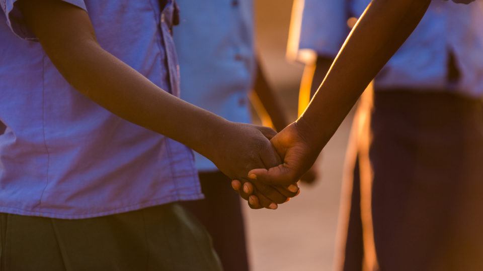 Children playing as the sun sets in Mwandi, Zambia.