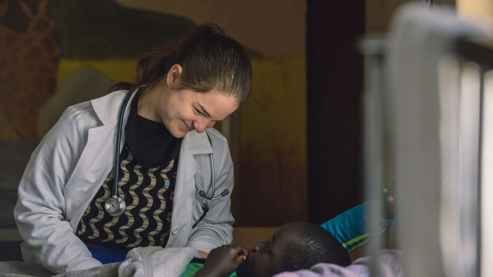 Stephanie Summa is caring for a child at the Mwandi Mission Hospital.