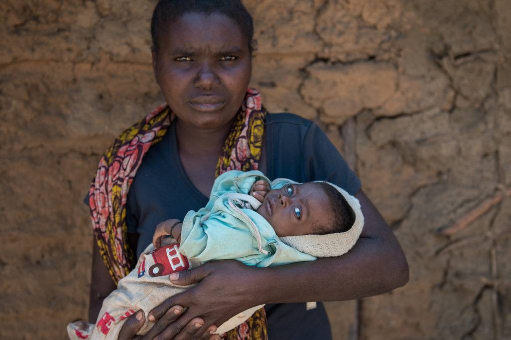 Shiela Kahundu Mukuwa with her baby Innutu in her village in Mwandi, Zambia.