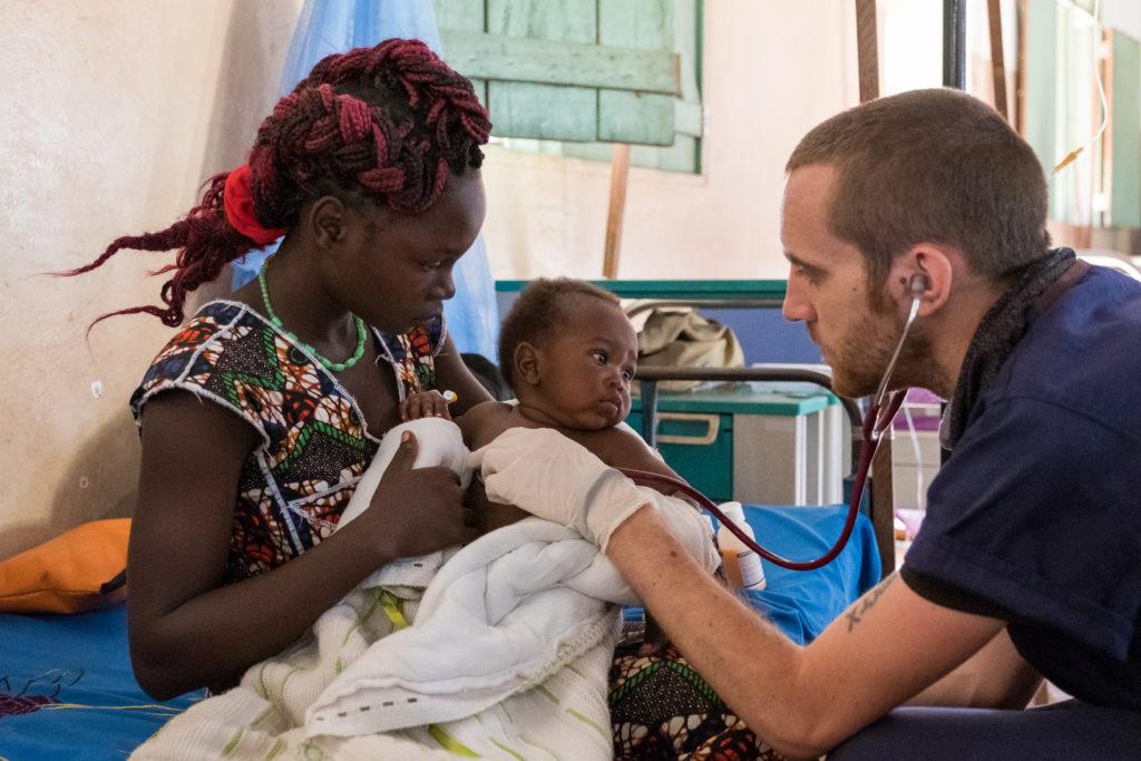 Dr. Matthew checks on one of his patients in the children's ward at St. Theresa Hospital in South Sudan.