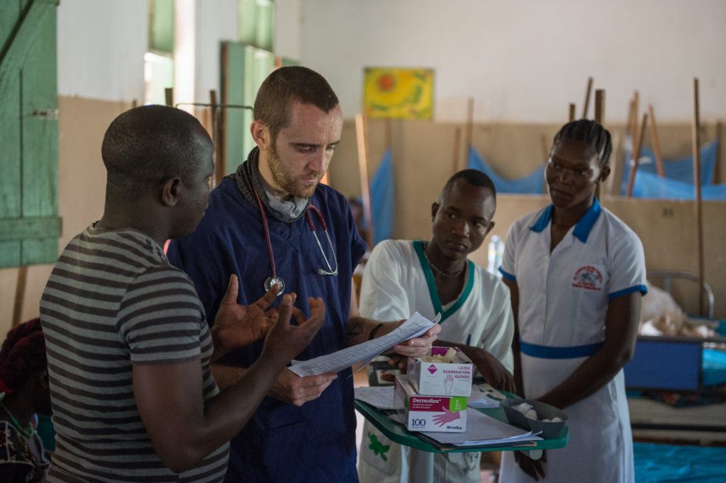Dr. Matt and local staff members talk with a patient's family members at St. Theresa Hospital in South Sudan.