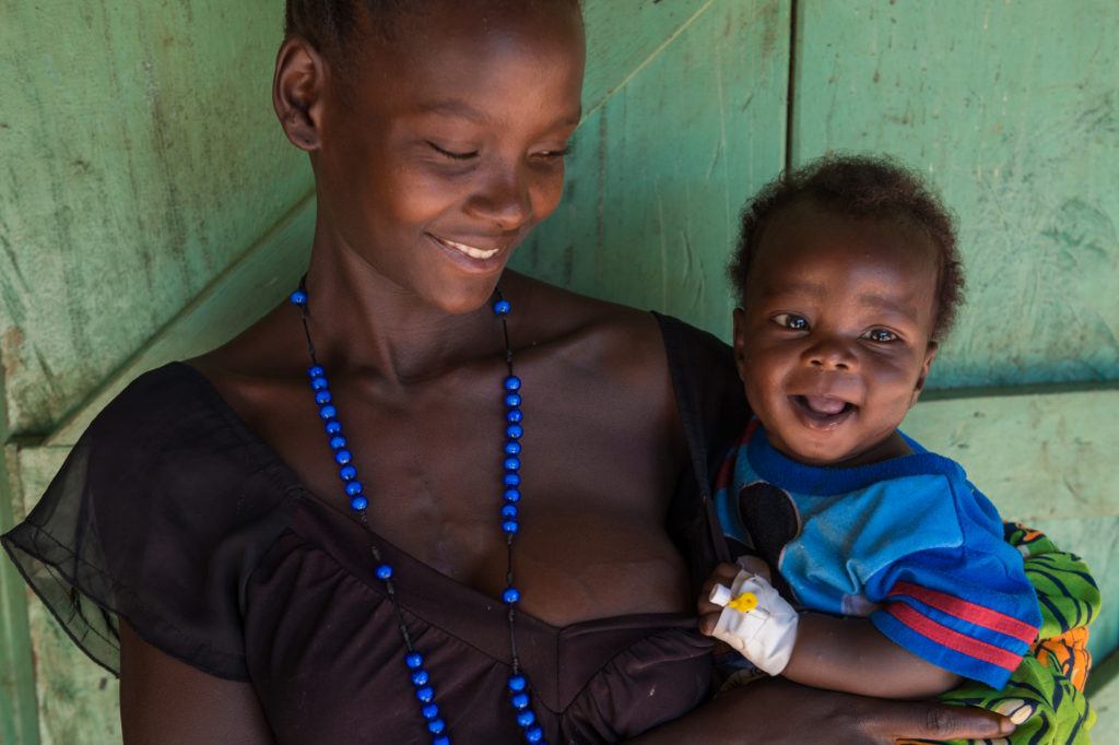 A mother and baby smiling