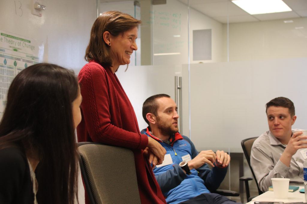 Dr. Matthew sits in on the presentation to provide the volunteers with further insights into Global Health.