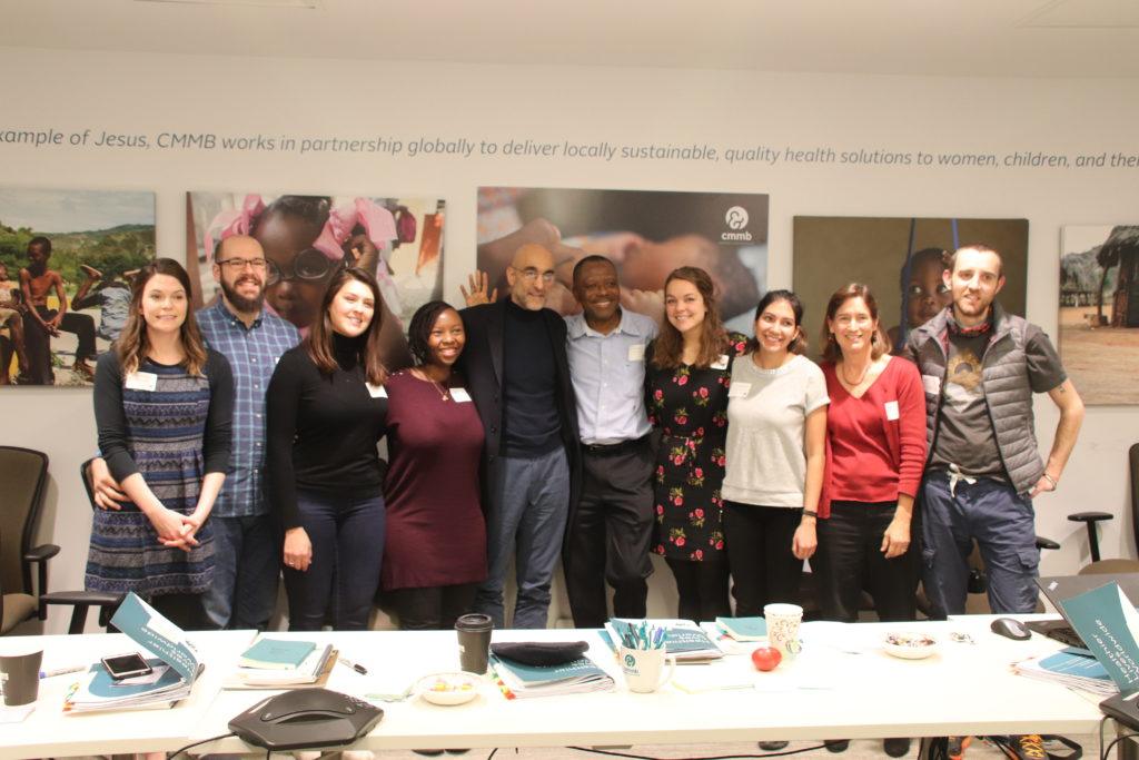 Dr. Tom takes a photo with our new cohort of volunteers.