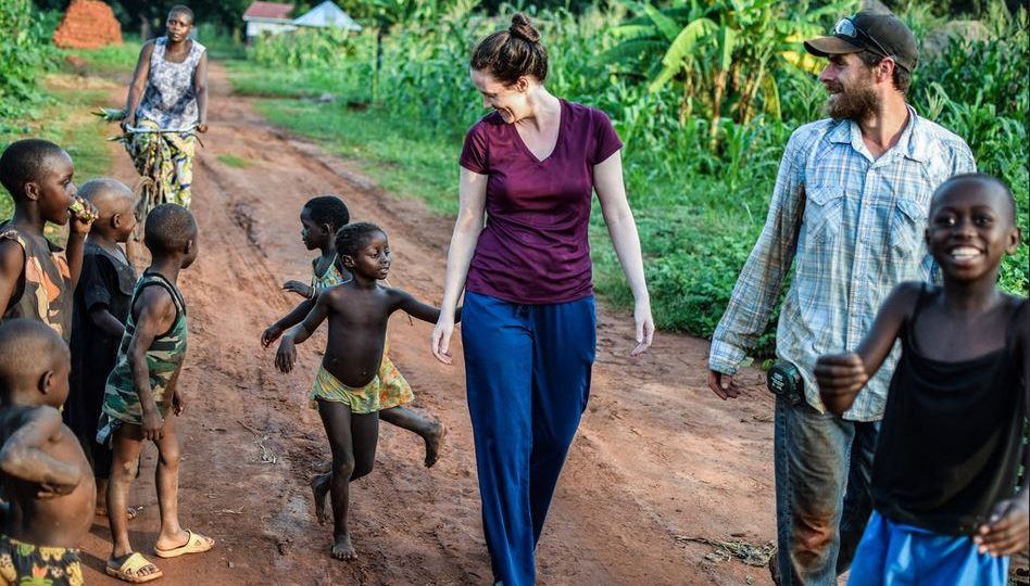 Sarah and Martin walking with children in South Sudan